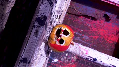 Slow motion video art of scary Halloween pumpkins and splashing colorful paints Video stock 286204119