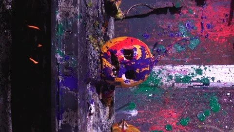 Slow motion video art of scary Halloween pumpkins and splashing colorful paints Stock Footage 286204309