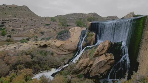 In this slow motion video, an artificial waterfall generates water energy. Stock Footage 263920901