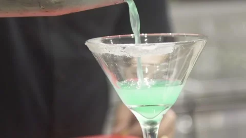 Slow Motion Video Bartender Pouring Cocktails in Glass Видео 219596437