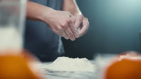 Slow-motion video of beating an egg into flour in the kitchen. Stock Footage 240020654