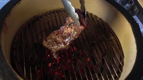 Slow motion video of a beef steak being filmed as it is cooked in the  Stock-Footage 150576506