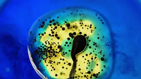 Slow Motion Video of Blue, Black, Yellow, and White Colors Mixing Video stock 278829922