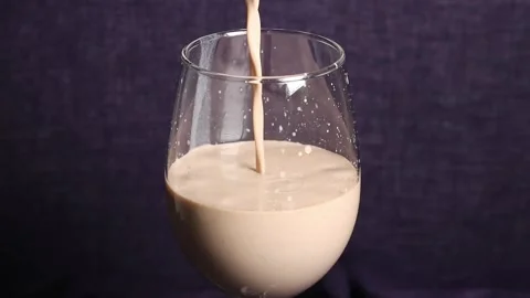 Slow Motion video of Bubble Tea is pouring into the wine glass Stock Footage 266682715
