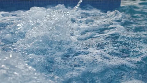 In this slow motion video, bubbles gracefully rise in a working jacuzzi. Stock Footage 262579883