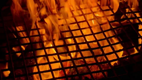Slow motion video of burning dry woods under the metal old grid. Industy and ene Stock Footage 221281485