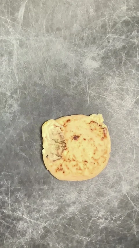 Slow-motion video captures cheese pupusas delicately landing on a dark marb.. Stock-Footage 277437909