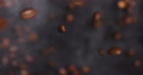 Slow-motion video captures the explosion of ground coffee and beans Stock Footage 260410521