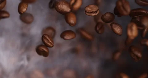 Slow-motion video captures the explosion of ground coffee and beans Stock Footage 260412186