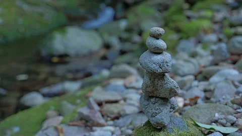 A slow-motion video capturing a small waterfall in a mountain stream Stock Footage 324560137