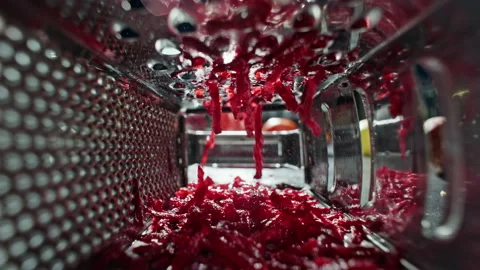 Slow motion video of a chef grating a beetroot in a restaurant kitchen. Stock Footage 231476434