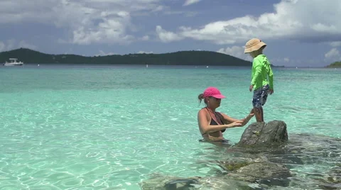 Slow motion video of child falling of a rock in Caribbean Stock Footage 66422674