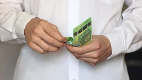 Slow motion video. Close-up of the hands of a young man in a white shirt Stock Footage 195118538