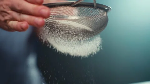 Slow motion video close-up of sifting flour in a sieve. Stock Footage 239016538