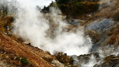 Slow Motion Video close up of smoke in Goshougake Onsen hotspring in autumn s Stock Footage 99689419