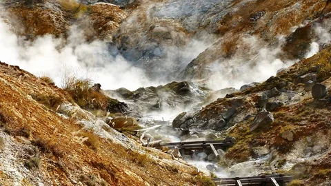 Slow Motion Video close up of smoke in Goshougake Onsen hotspring in autumn s Stock Footage 100179167