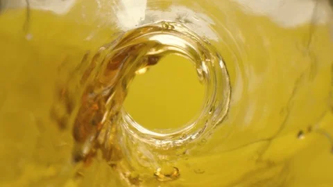 Slow motion video of cola swirl inside glass bottle Stock Footage 112281121