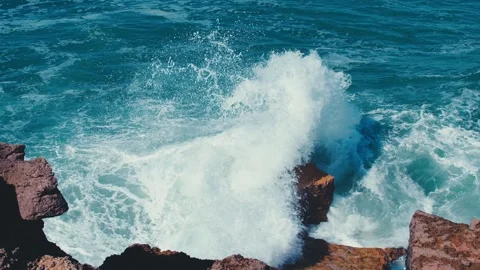 Slow motion video: Crashing waves creating huge splashes.  Ocean Waves. Stock Footage 329693790
