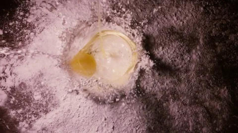 Slow motion video of a drop of egg yolk to the flour 240 fps Video stock 71194087