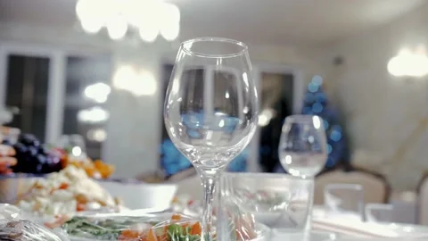 Slow motion video of an empty wine glass on a festive table in a restaurant. Stock Footage 231808675