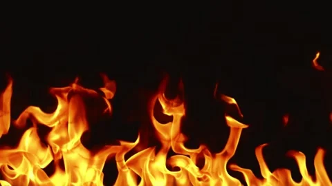 Slow motion video of fire and flames burning gas or gasoline ignited by fire. Stock Footage 240273023