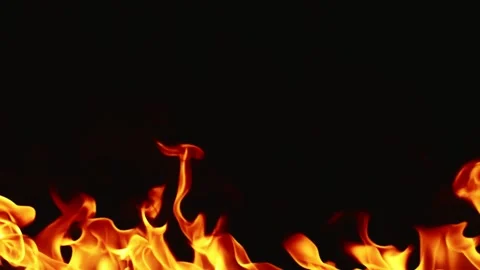 Slow motion video of fire and flames burning gas or gasoline ignited by fire. Stock Footage 240273025