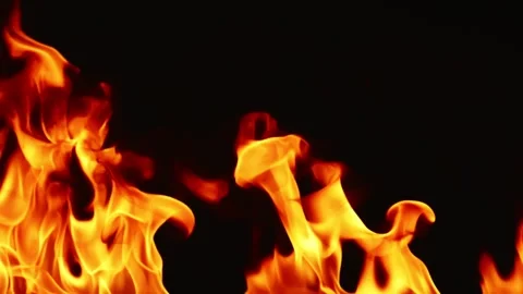 Slow motion video of fire and flames burning gas or gasoline ignited by fire. Stock Footage 240273121