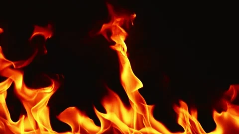 Slow motion video of fire and flames burning gas or gasoline ignited by fire. Stock Footage 240273313