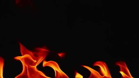 Slow motion video of fire and flames burning gas or gasoline ignited by fire. Stock Footage 240273339