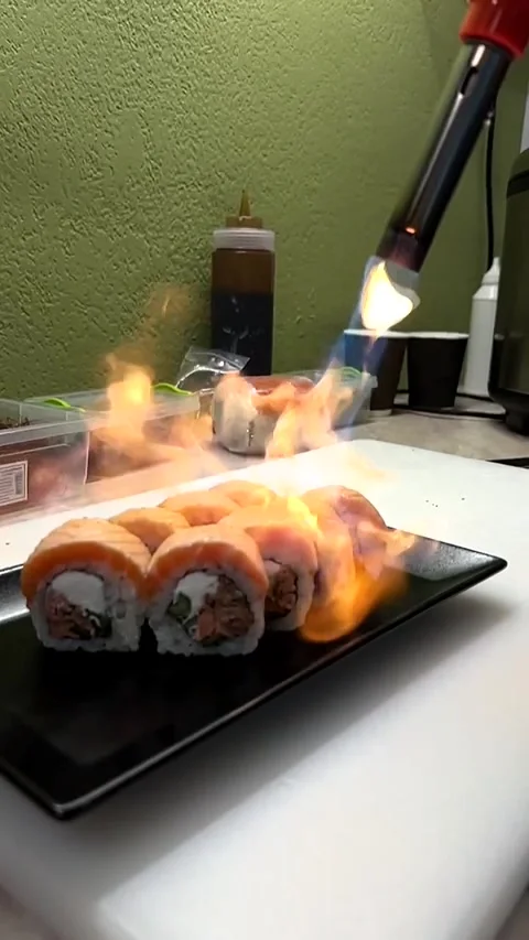 Slow Motion Video of Fire Scorching Delicious Sushi in the Kitchen Close Up Stock Footage 285252471