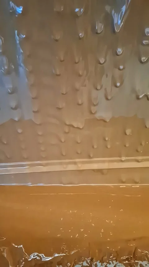 Slow motion video of flowing liquid melted chocolate at a chocolate factory Stock Footage 337326060