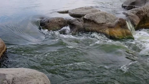 Slow motion video of flowing river among the stones at spring. Nature riversi Stock Footage 130241919