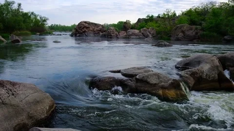 Slow motion video of flowing river among the stones at spring. Nature riversi Stock Footage 130241930
