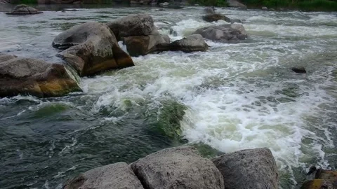 Slow motion video of flowing river among the stones at spring. Nature riversi Stock Footage 130241933