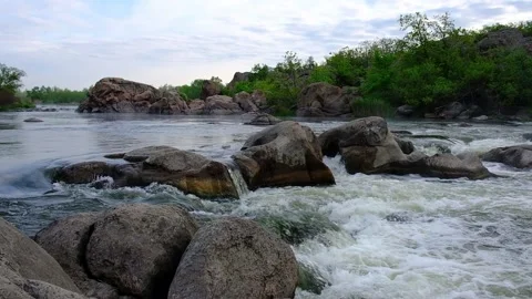 Slow motion video of flowing river among the stones at spring. Nature riversi Stock Footage 130241934