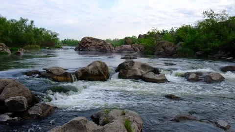 Slow motion video of flowing river among the stones at spring. Nature riversi Stock Footage 150353082