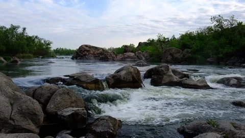 Slow motion video of flowing river among the stones at spring. Nature riversi Stock Footage 150353084