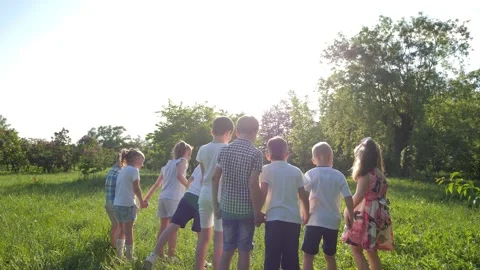 Slow-motion video. A group of children, having fun running in the park Video stock 156327092