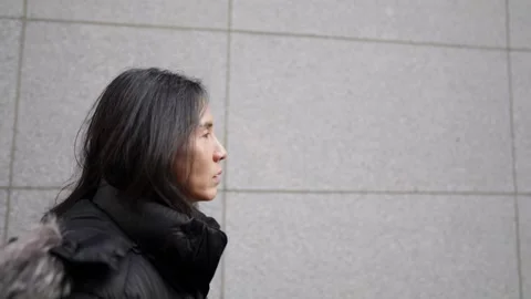 Slow-motion video of a Korean man in his 30s walking on the main street Видео 262214060