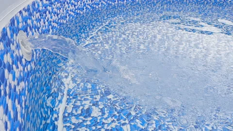 Slow motion video of a large jet of water filling a pool Stock Footage 250355364