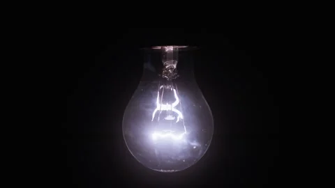Slow motion video of a light bulb turning on and off Vídeo Stock 309052580