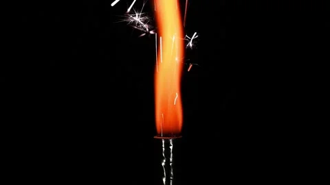 Slow motion video of light a candle and burning candle fireworks. Stock Footage 167121945