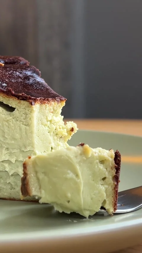 Slow motion video of lime cheesecake on a plate Stock Footage 308776371