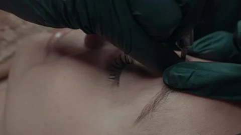 Slow-motion Video of microblading work. Permanent makeup on the eyebrow. Stock Footage 223159763
