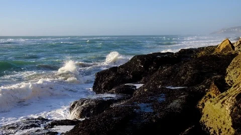 Slow motion video of ocean waves crushing rocky coast. Awesome power of waves Stock Footage 121198230