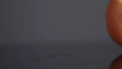 Slow Motion Video of an Orange Falling and Splitting - High Impact Fruit Footage Stock Footage 273183060