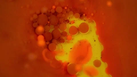 Slow-motion video of a paint bubble bursting and mixing with another. Stock Footage 281245497