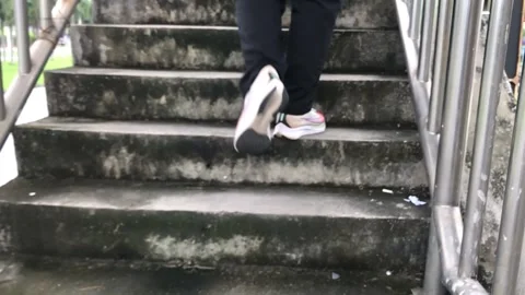 Slow motion video of people walking up stairs Stock Footage 219020421