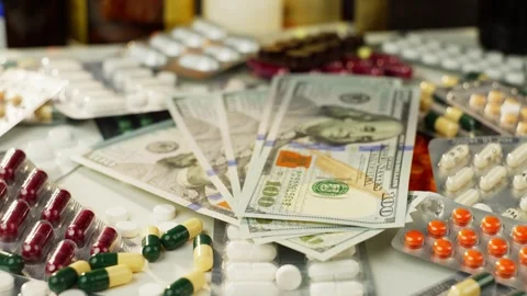 Slow Motion Video of Pills Dropping onto Medicine Containers and Packaging Video stock 278829552