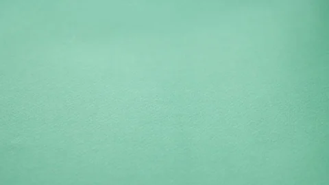 Slow motion video pills falling on green background. pills supplements closeup Stock-Footage 125930359